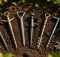 seven garden edging spikes securing borders